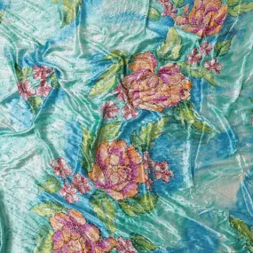 Turquoise blue to cerulean blue Rayon velvet fabric having white and yellow stonework in floral design